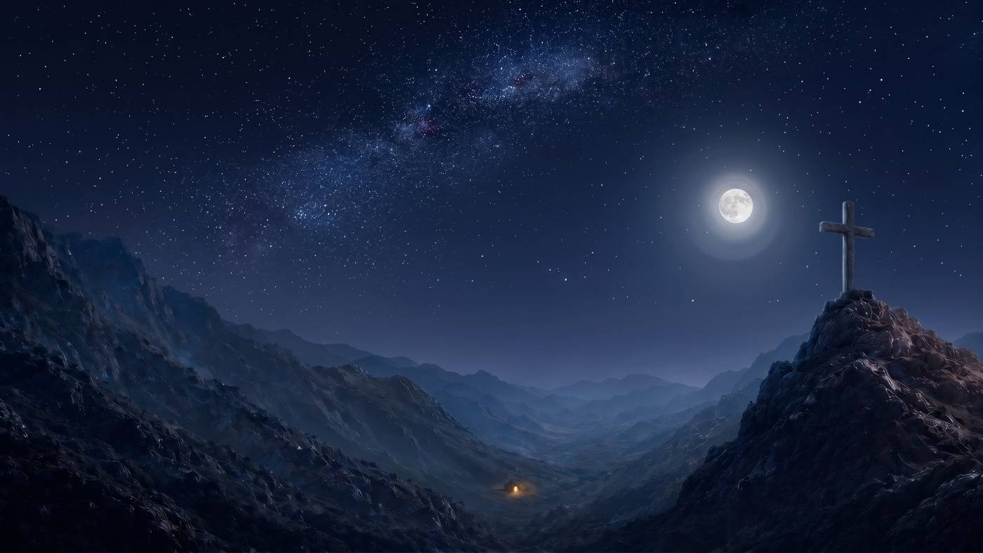 A cross on a mountain ridge under a moonlit, star-filled sky